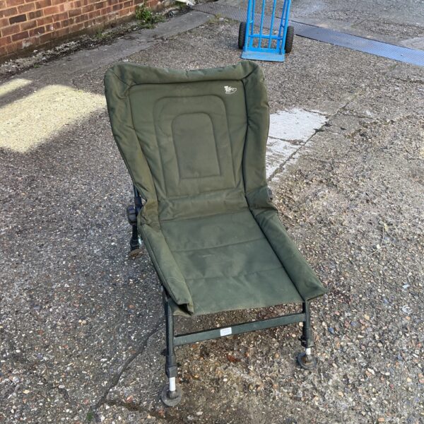 Side view of a used Nash fishing chair for angling.