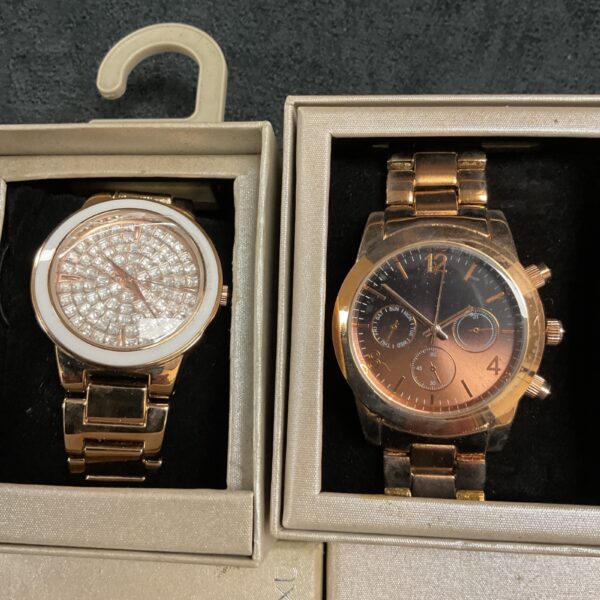 Pair of Next fashion wristwatches in original boxes, gold tone.