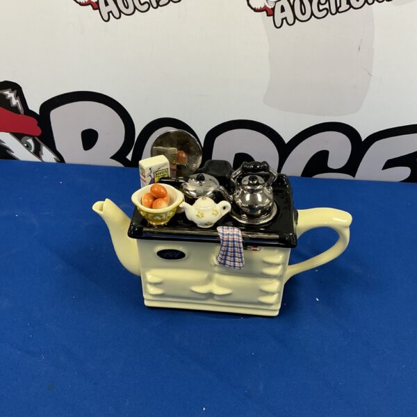 Vintage novelty teapot designed as a stove top.