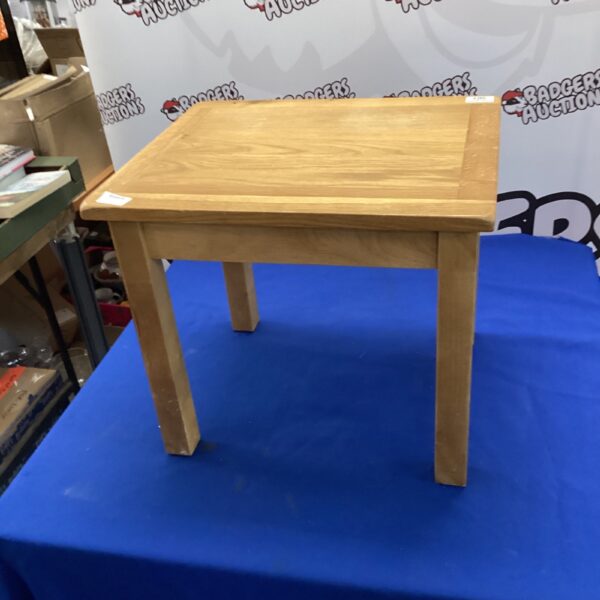 Vintage oak side table with a square top and simple legs.
