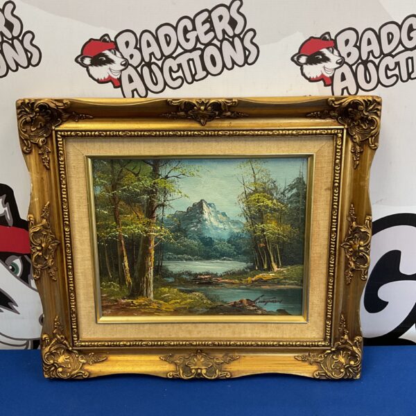 Signed oil painting of a mountain river landscape.