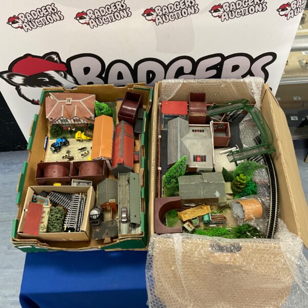 OO gauge model railway scenery lot with buildings and landscape features.