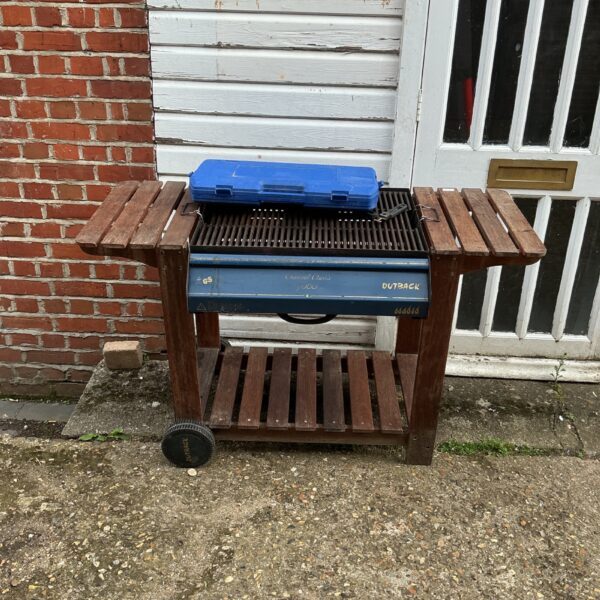 Vintage Outback 3000 barbecue grill in garden setting.