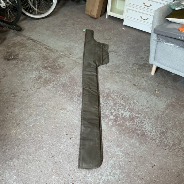Dark padded fishing rod bag for secure transport.