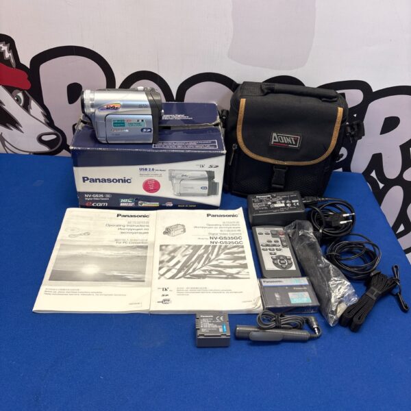 Panasonic NV-GS25GC camcorder in box with accessories.