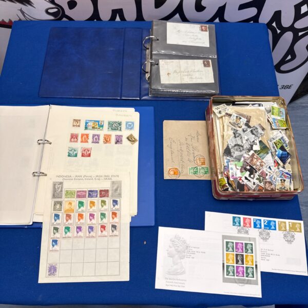 Antique Penny Red stamp collection with letters and loose stamps.