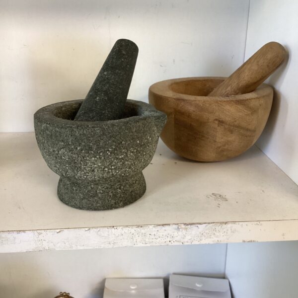 Stone and wood pestle and mortar set for grinding spices.