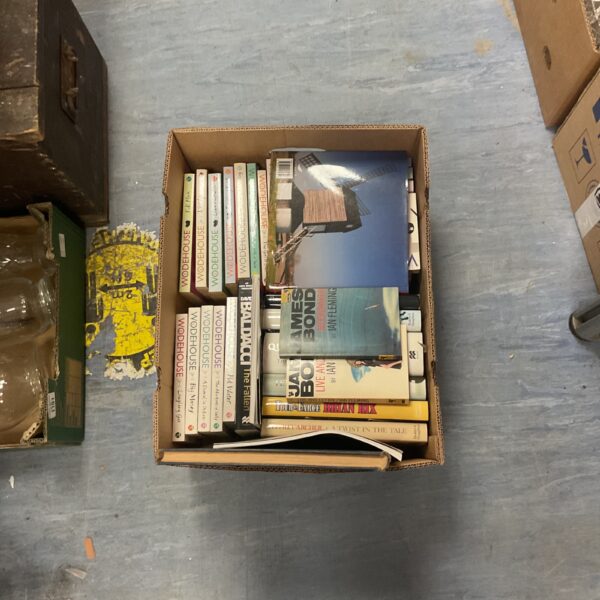 Vintage lot of PG Wodehouse and Ian Fleming paperback books.