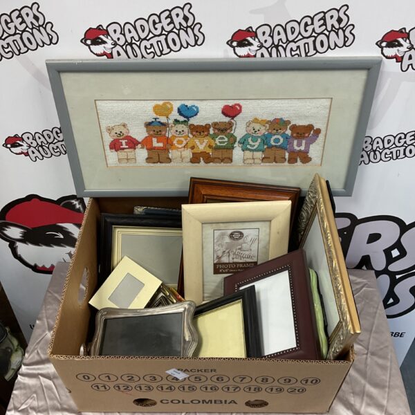 Assorted vintage photo frames including a silver plate frame.