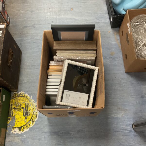 Assorted photo frame lot with various sizes and styles.