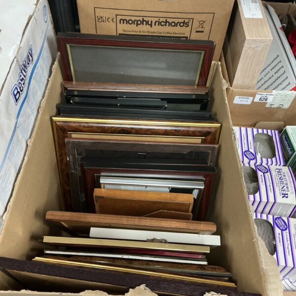 Assorted picture frames lot for wall decor and photo display.