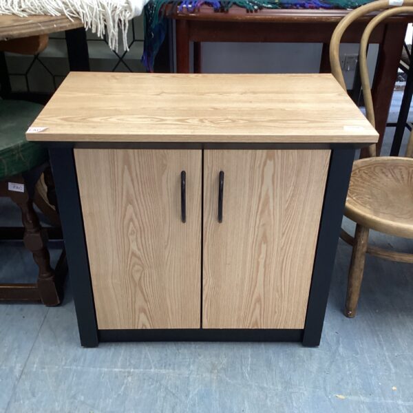 Vintage pine hallway cupboard with two doors.