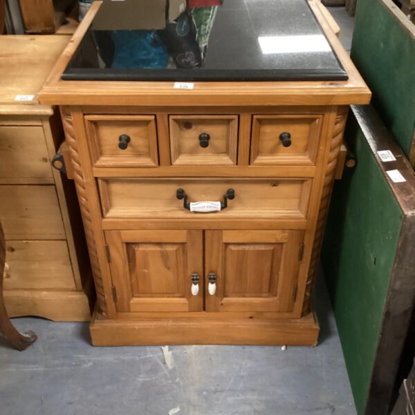 Vintage pine kitchen unit with marble top for storage.