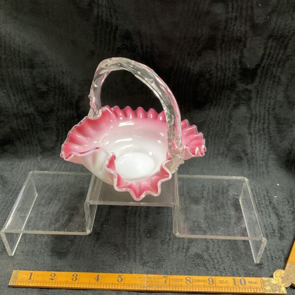 Antique pink cased glass brides basket with ruffled edge.