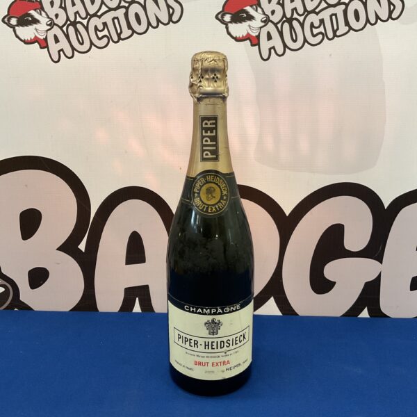 Sealed vintage Piper Heidsieck Brut Extra Champagne bottle.