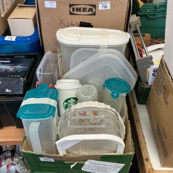 Assorted plastic food storage boxes in a mixed lot for kitchen organisation.