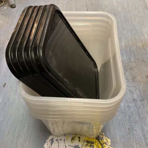 Stack of six durable plastic storage buckets for utility and organization.