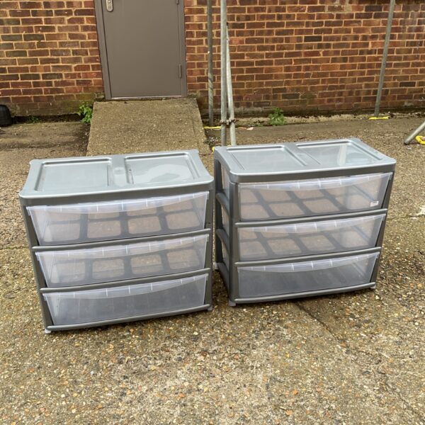 Two sets of plastic storage drawers for home organisation.