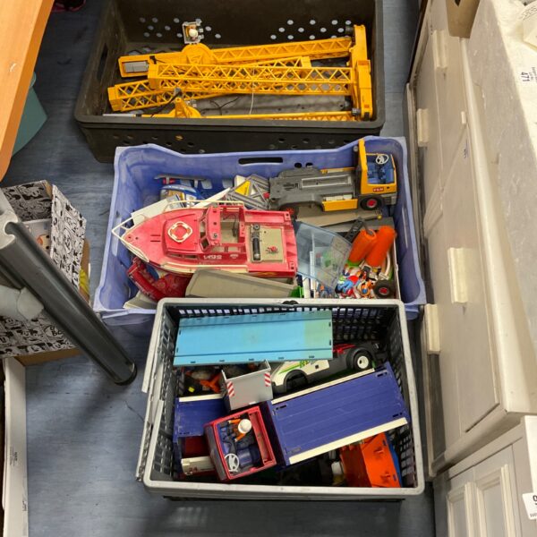 Vintage Playmobil lot with crane, boats, and trucks for collectors.