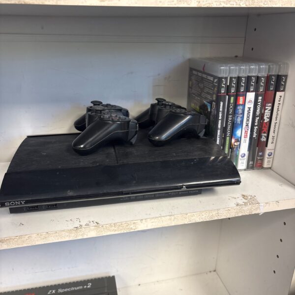 Sony Playstation 3 Super Slim console with controllers and games.
