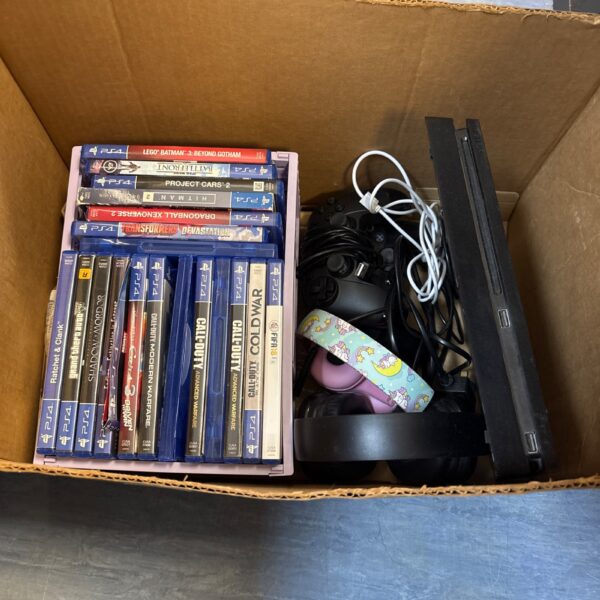 PlayStation 4 Slim console bundle with controllers and games.