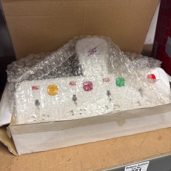 Four gang plug socket extender presented in protective packaging.