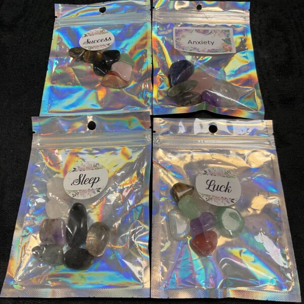 Sealed bags of polished crystal stones for collection or display.