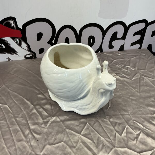 Vintage porcelain snail planter for garden or home decor.