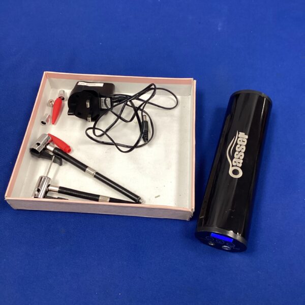 Portable tyre inflator with attachments and power cable.