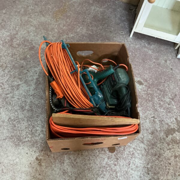 Mixed lot of power tools including a Bosch drill and orange cable.