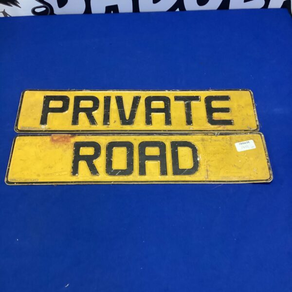 Vintage yellow metal “Private Road” sign for collectors.