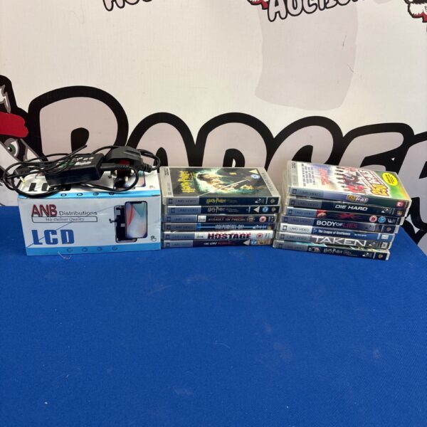 PSP UMD video lot with charger for portable gaming.