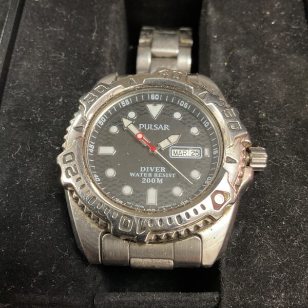 Vintage Pulsar divers watch with black rotating bezel and stainless steel bracelet.