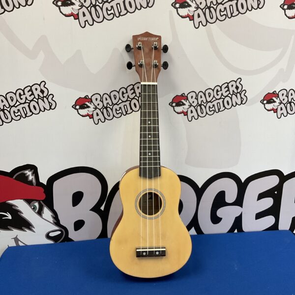 Vintage Pure Tone soprano ukulele, a classic musical instrument.
