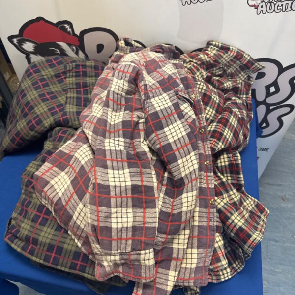 Three quilted lumberjack jackets in red and black plaid.