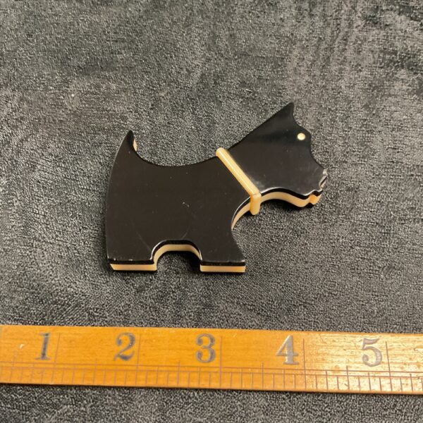 Vintage black bakelite Radley Dog lighter, front view.