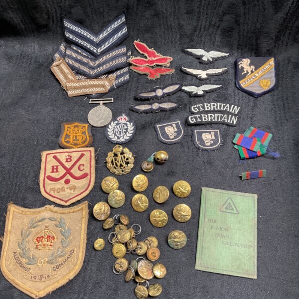 Diverse collection of RAF and RCAF badges and buttons, vintage military insignia.