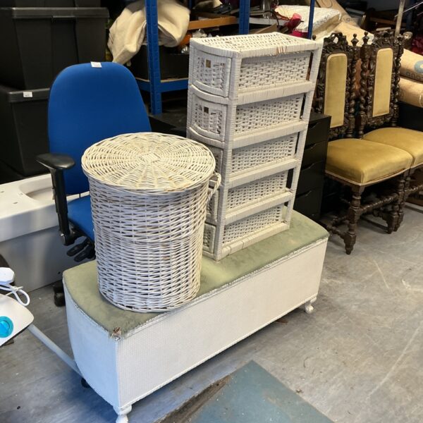 Vintage raffia ottoman with storage basket and tiered unit.