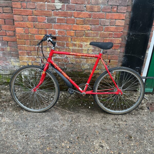 Side view of a vintage Raleigh Scorpion mountain bike.