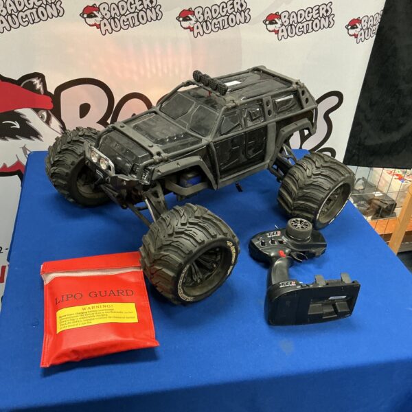 Remote control buggy with handset, ideal for off-road adventures.