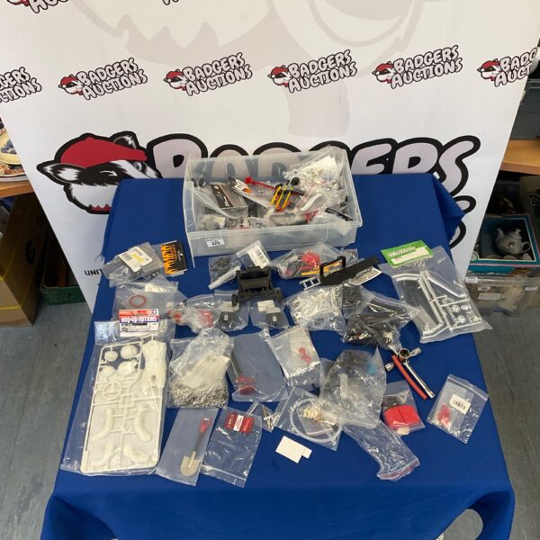 Mixed lot of RC car parts and accessories for remote control cars.