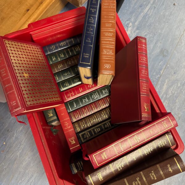 Vintage Readers Digest books in a red container.