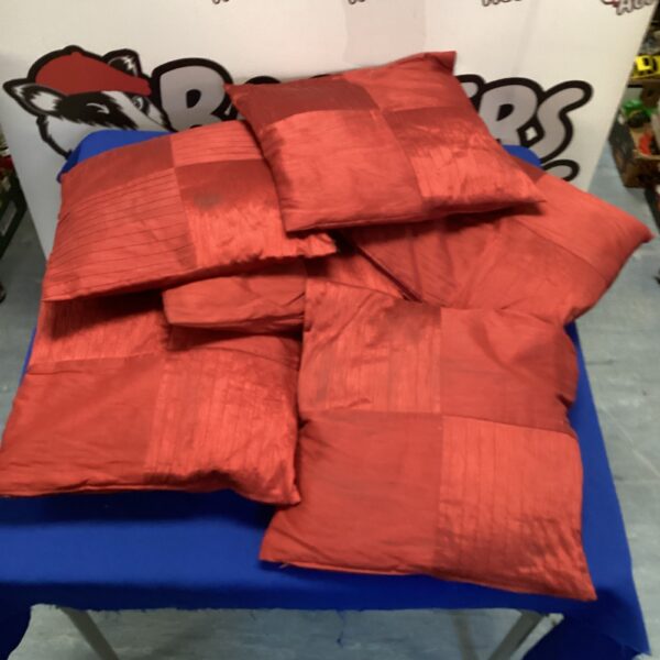 Lot of six red cushions for home decor.