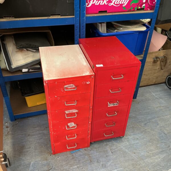 Vintage red metal filing chest with five drawers for office storage.