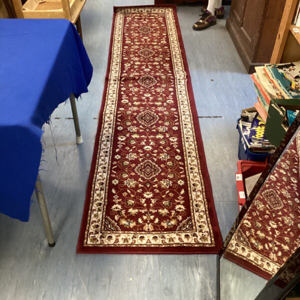 Detailed red Sherborne rug, 66x300cm, patterned floor covering.