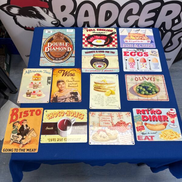 Lot of reproduction cafe signs with vintage branding.