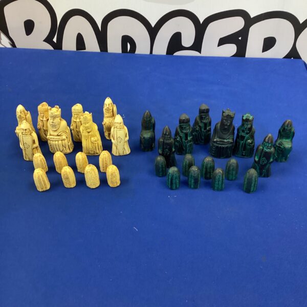 Detailed resin chess pieces set for tabletop gaming.