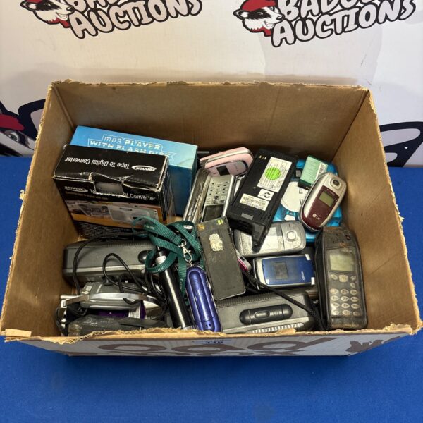 Mixed lot of vintage mobile phones and a walkie-talkie.