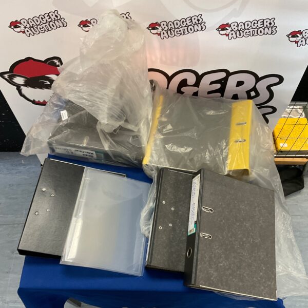 Lot of ring binders in plastic bags, office filing supplies.