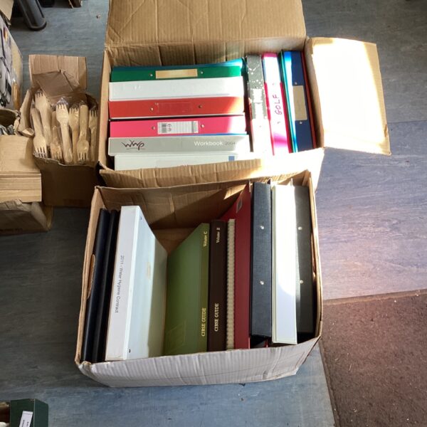Mixed lot of colourful ring binders for document storage.